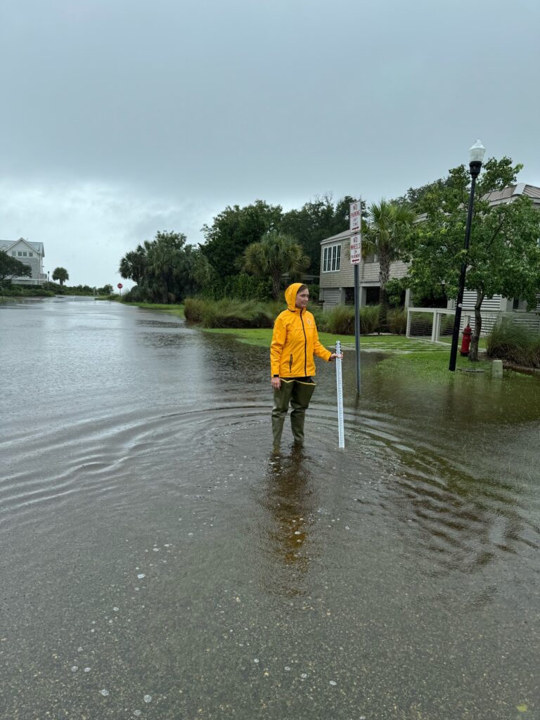 a person standing in a flooded street (MyCoast AI)