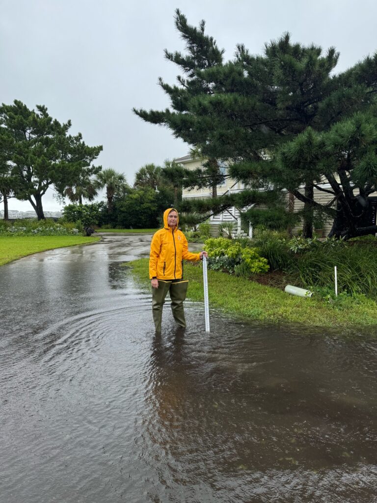 a man standing in a flooded street (MyCoast AI)