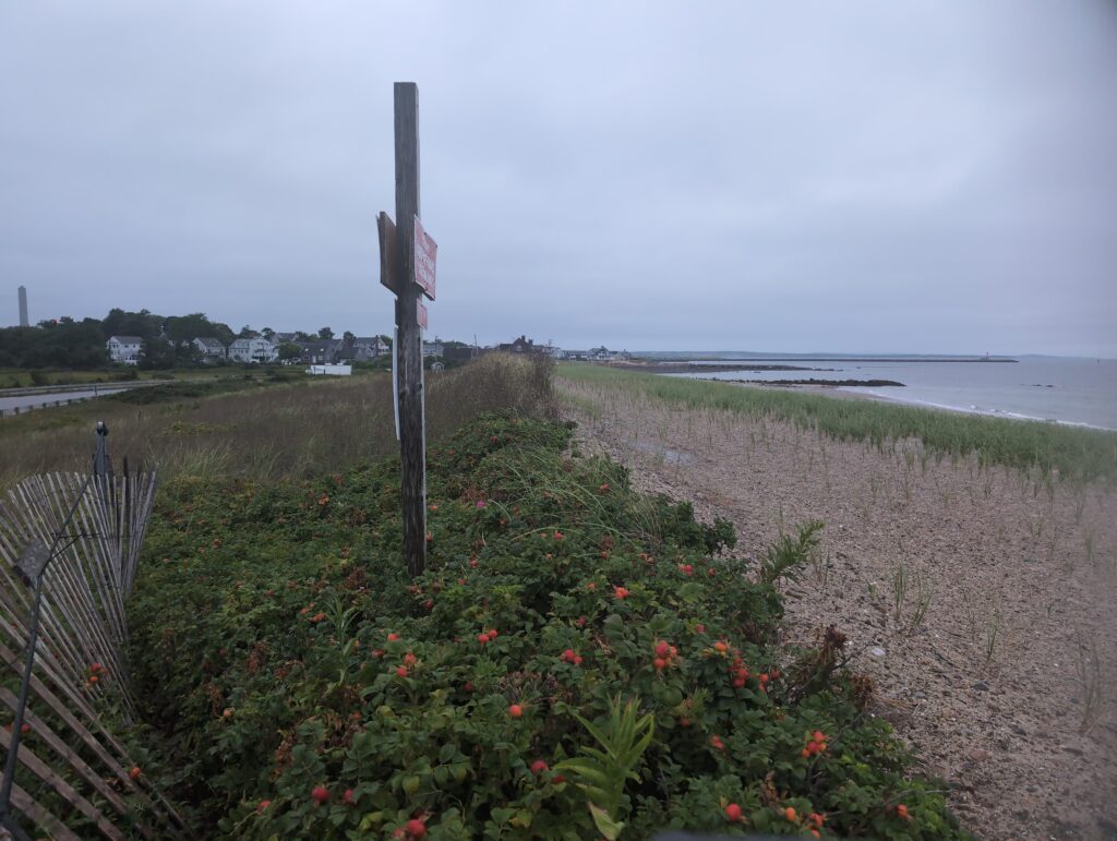 a sign on a pole (MyCoast AI)