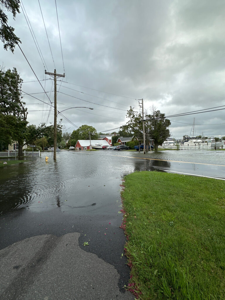 a flooded street with power lines (MyCoast AI)