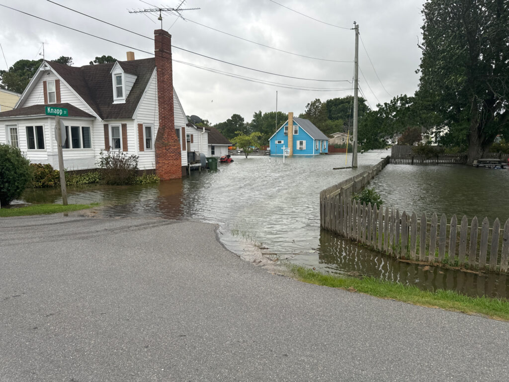 a flooded street with houses (MyCoast AI)