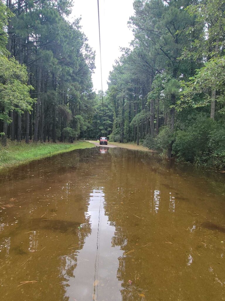 a flooded road with cars (MyCoast AI)