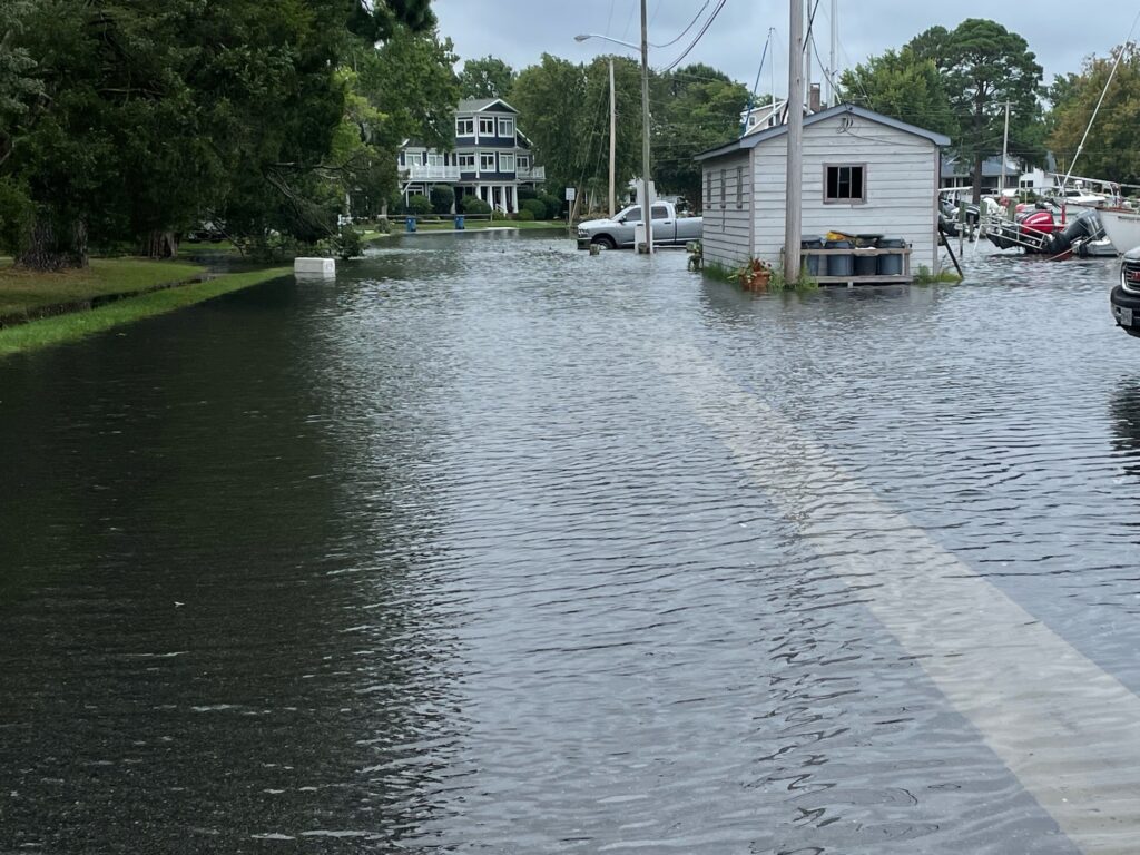 a flooded area with boats and houses (MyCoast AI)