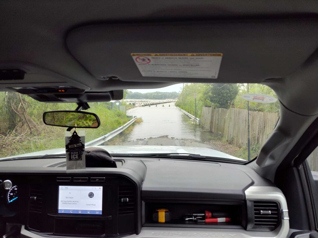a car with a sign on the dashboard (MyCoast AI)