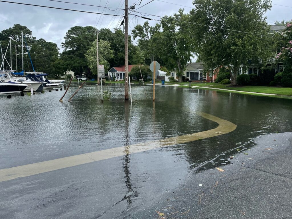 a flooded street with boats (MyCoast AI)