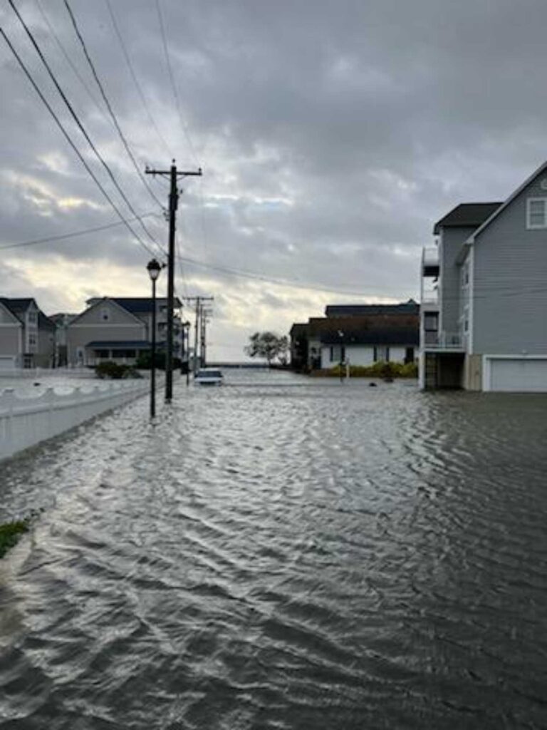 a flooded street with houses (MyCoast AI)