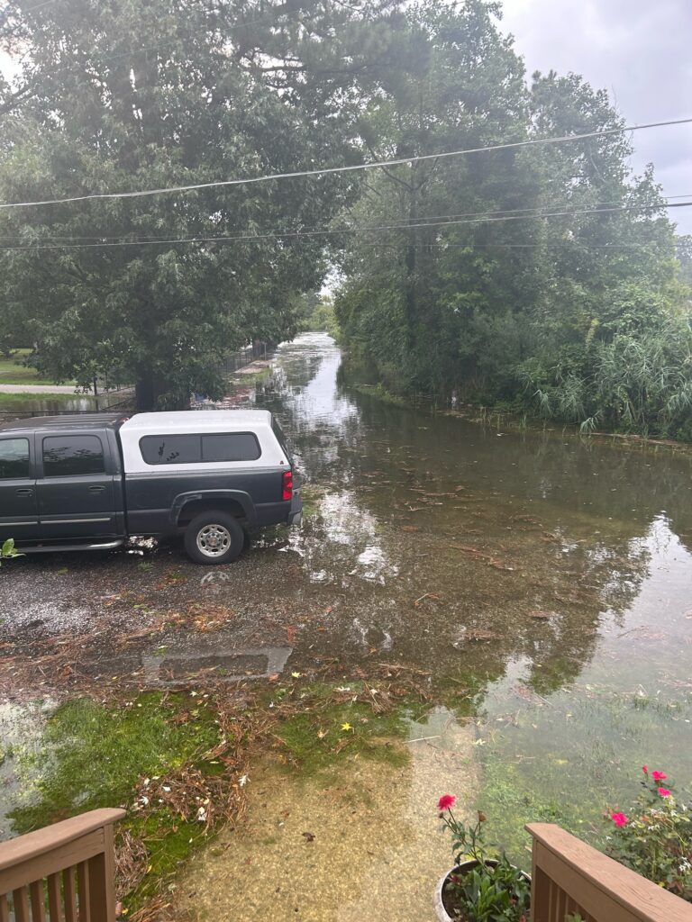 a van parked by a river (MyCoast AI)