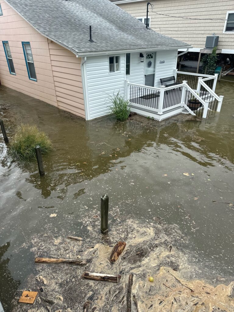 a flooded street with a house (MyCoast AI)