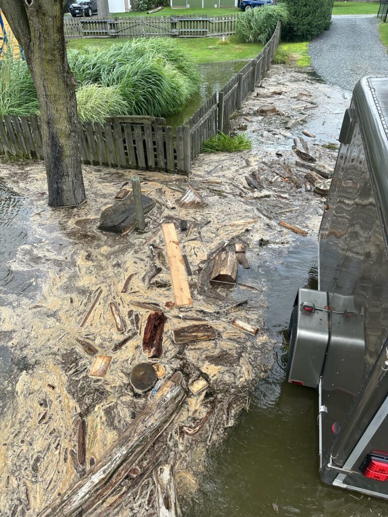 a truck with a pile of wood in it (MyCoast AI)