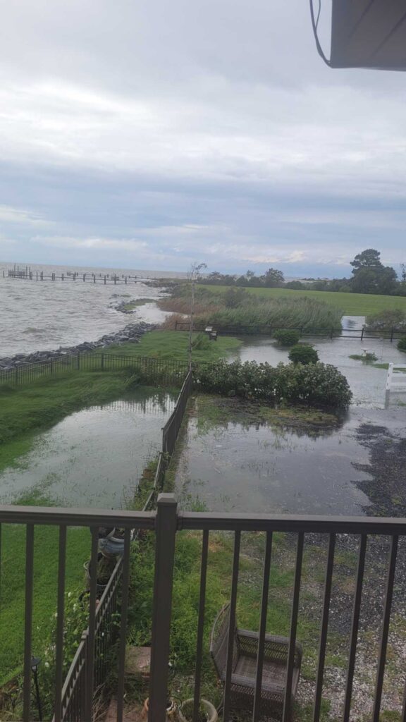 a flooded area with a fence (MyCoast AI)
