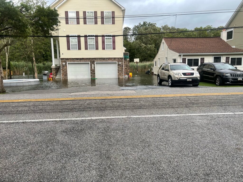 a couple of cars parked on the side of a road (MyCoast AI)