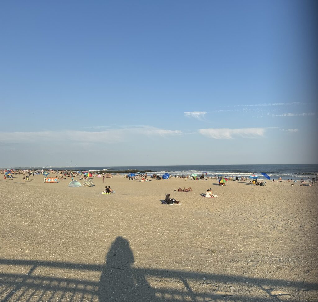 a beach with people on it (MyCoast AI)