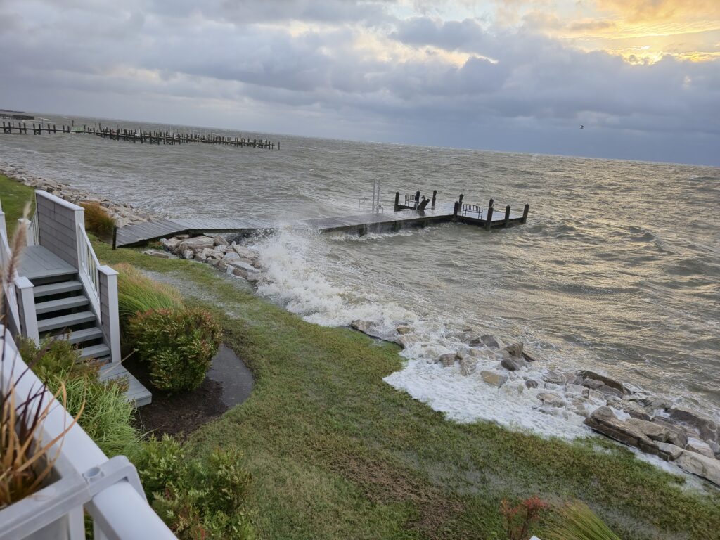 a beach with a pier and a body of water (MyCoast AI)