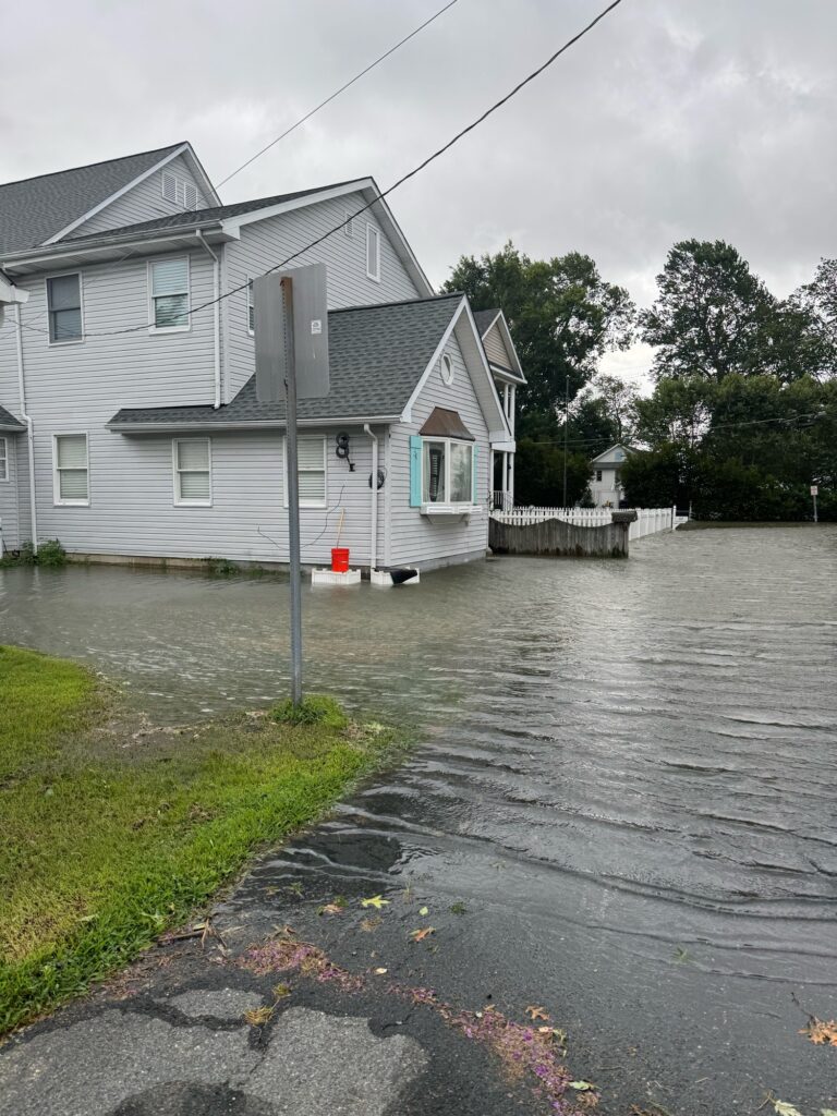 a flooded street with a house (MyCoast AI)