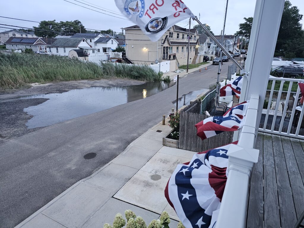 a row of white chairs on a bridge over a river (MyCoast AI)