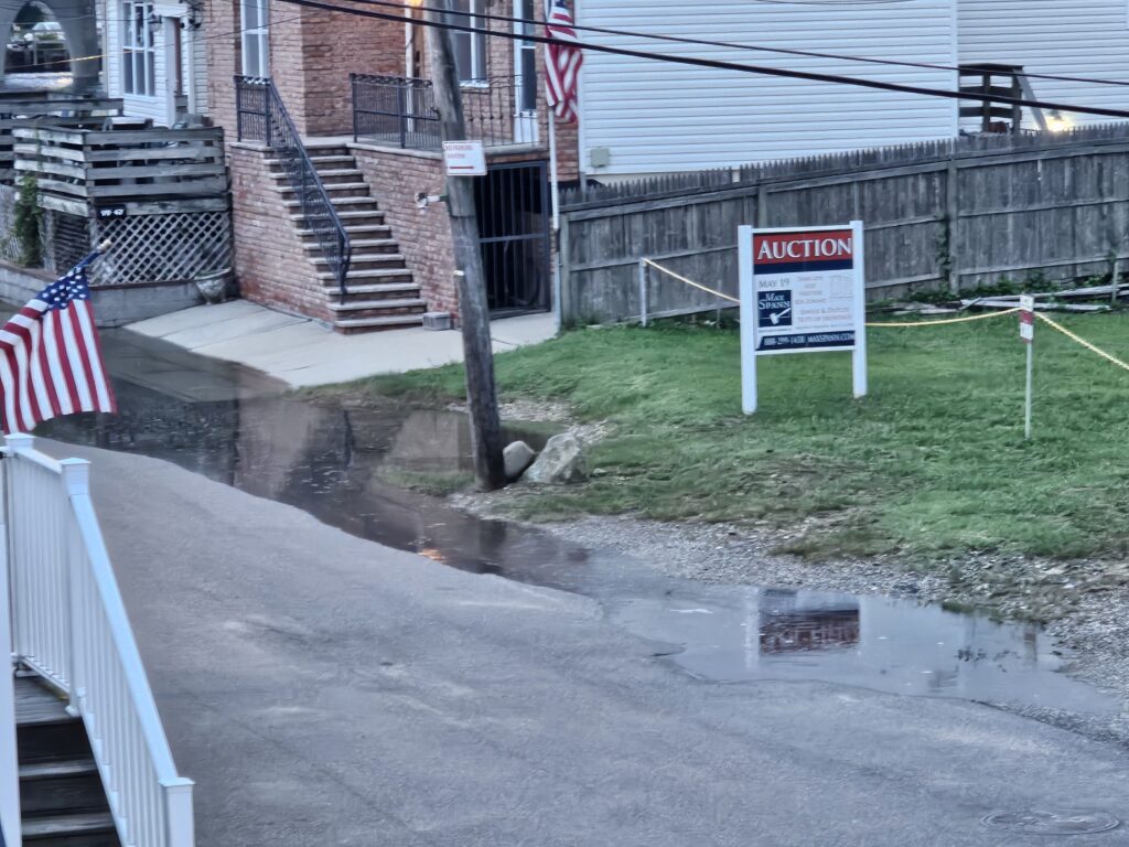 a sign on a fence (MyCoast AI)