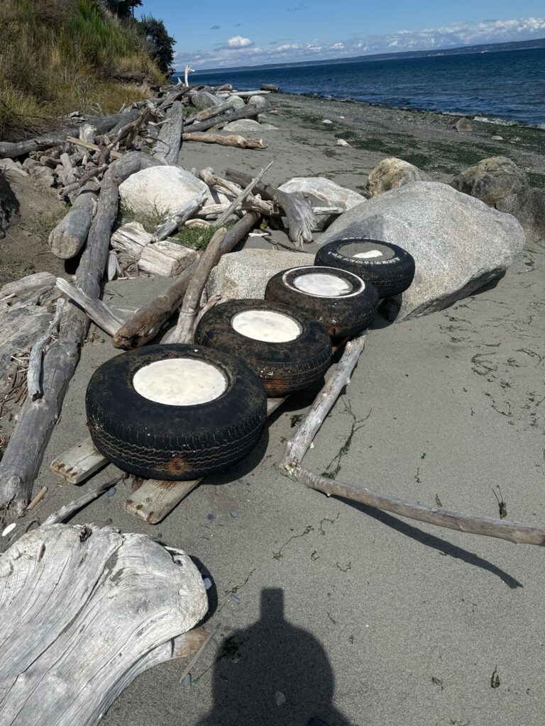 a pile of tires on a beach (MyCoast AI)
