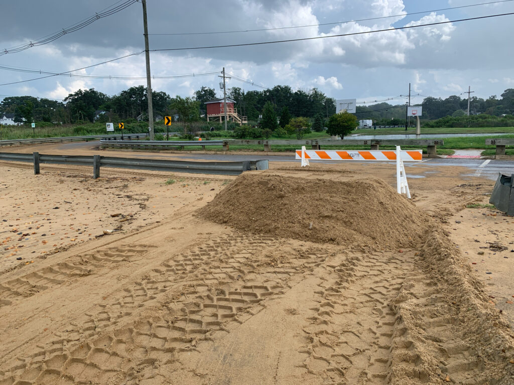 a construction site with a pile of dirt and a road (MyCoast AI)