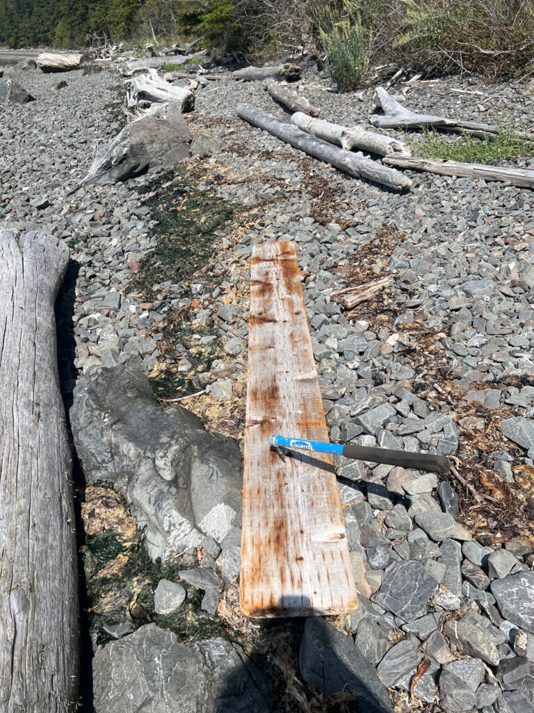 a wood cross on a rocky ground (MyCoast AI)