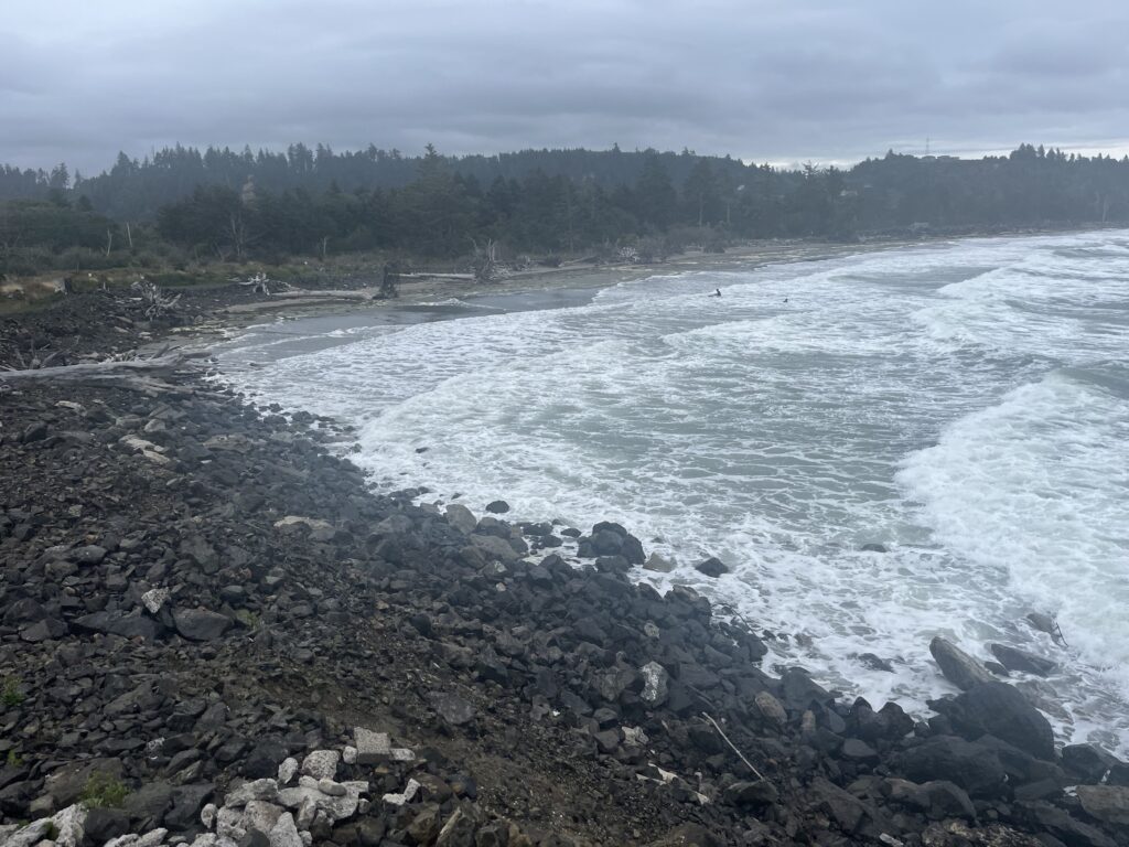 a rocky beach with waves crashing (MyCoast AI)