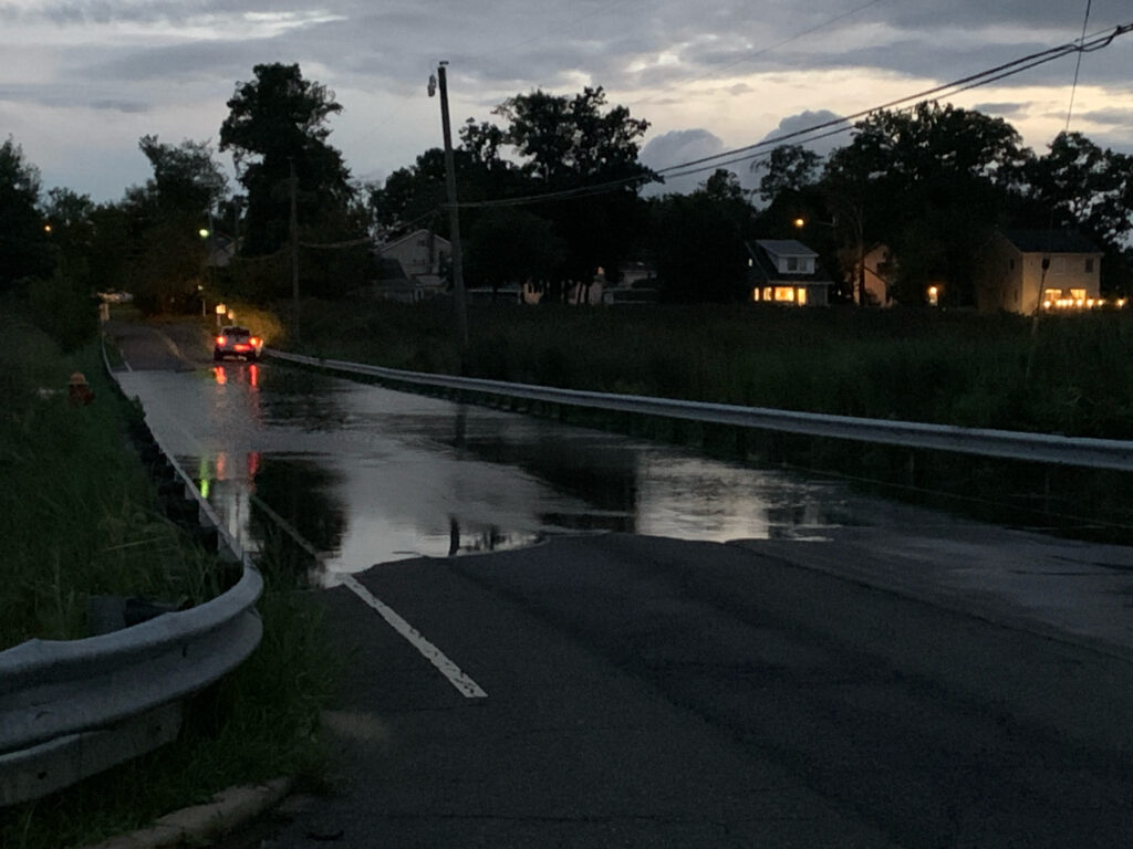 a flooded street with cars (MyCoast AI)