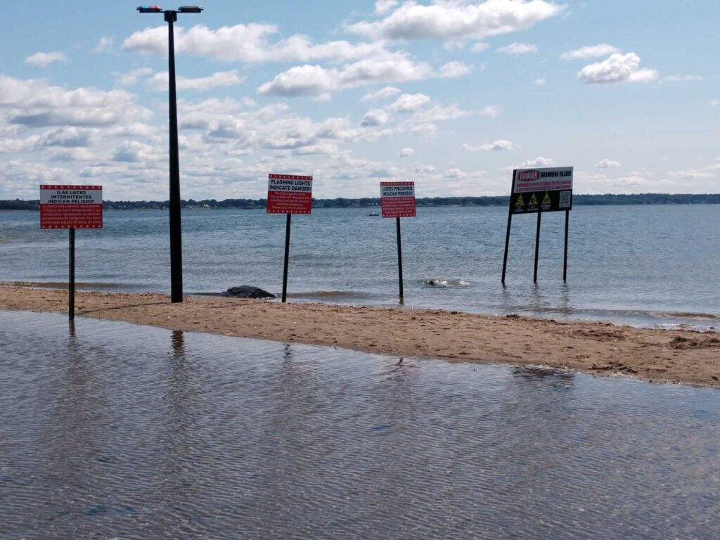 a group of signs on a beach (MyCoast AI)