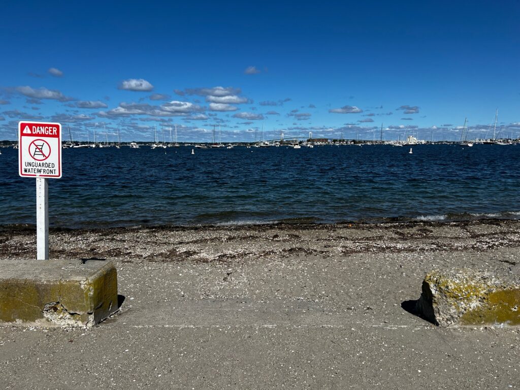 a sign on the beach (MyCoast AI)