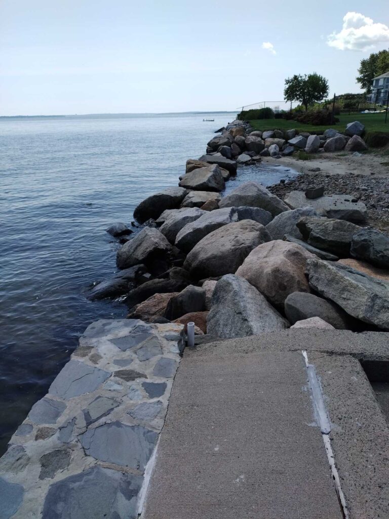 a rocky shoreline with a bird on it (MyCoast AI)