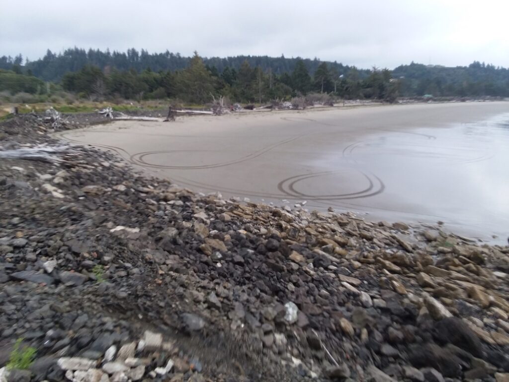 a rocky beach with a road (MyCoast AI)