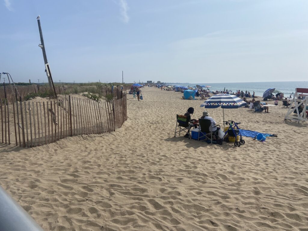 a beach with people and umbrellas (MyCoast AI)