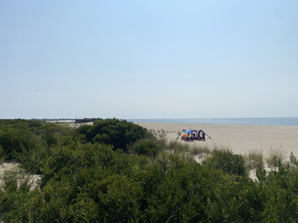a helicopter flying over a beach (MyCoast AI)