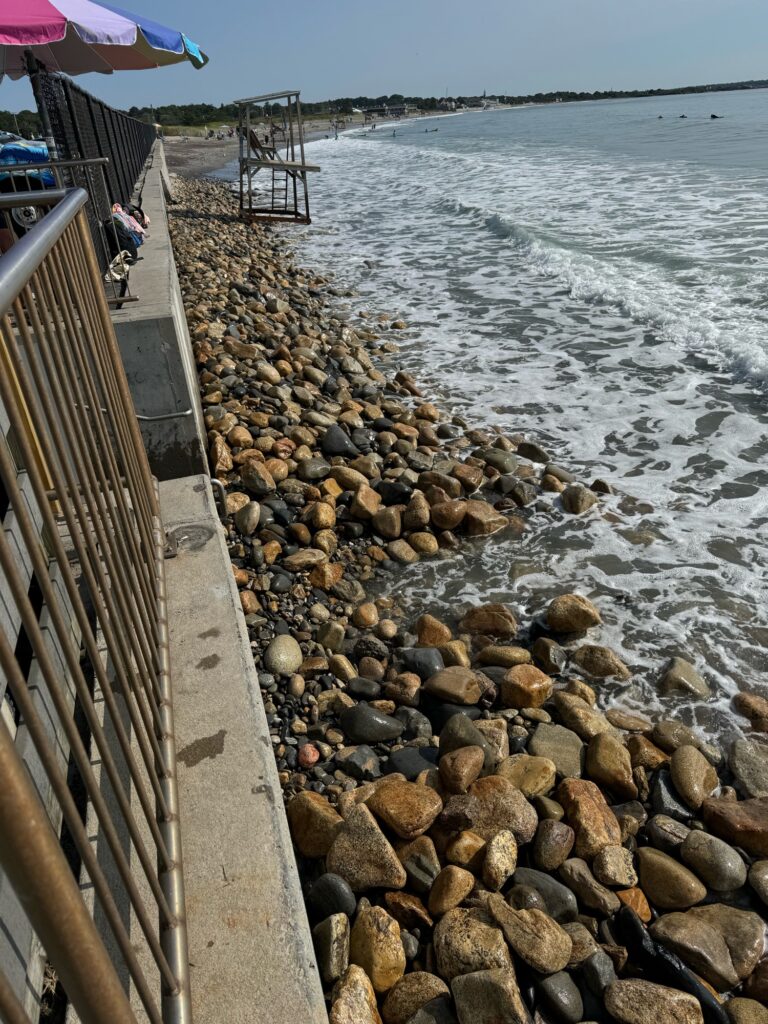 a rocky beach with a walkway (MyCoast AI)