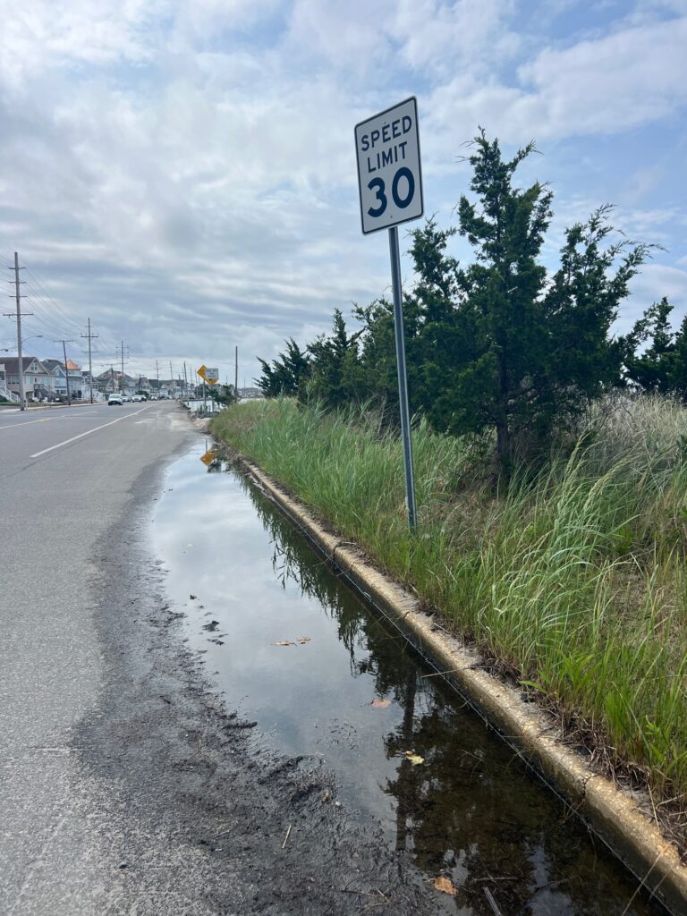 a sign on the side of a road (MyCoast AI)