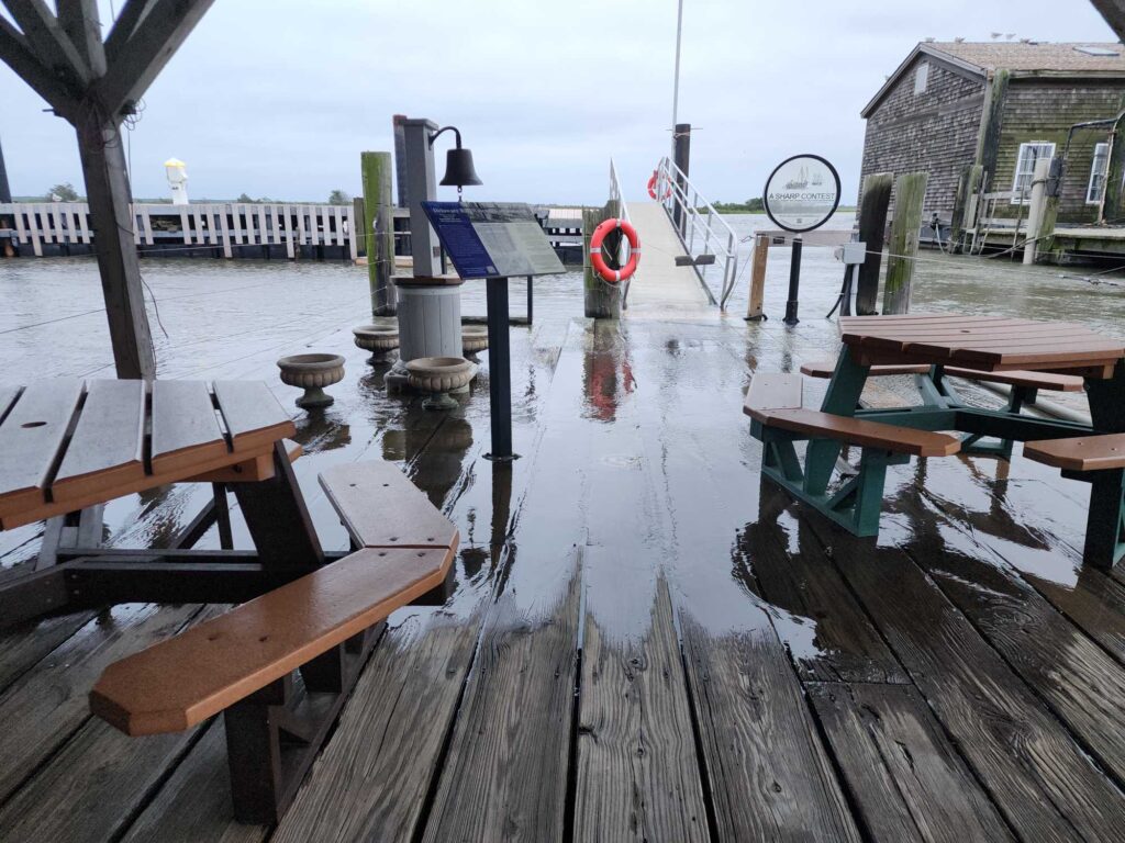 a group of tables and chairs on a dock (MyCoast AI)