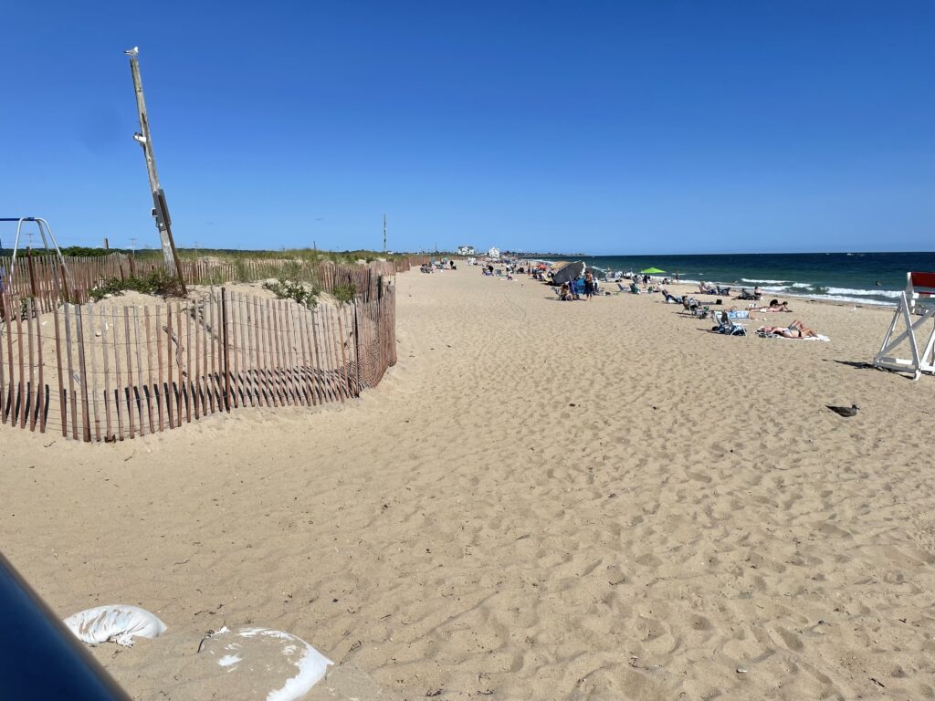 a sandy beach with a fence (MyCoast AI)