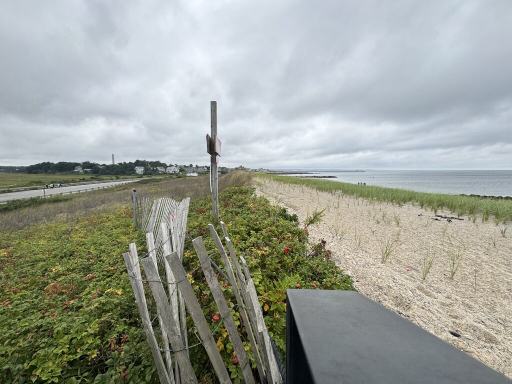 a wooden fence on a beach (MyCoast AI)