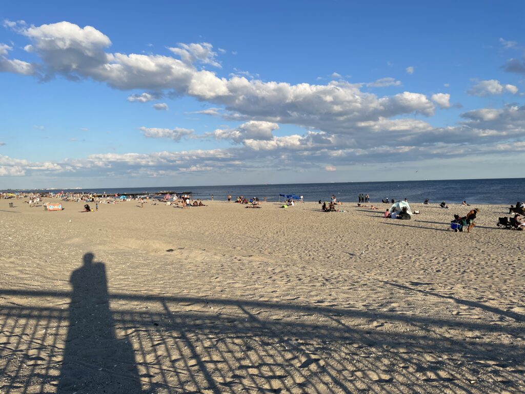 a group of people on a beach (MyCoast AI)