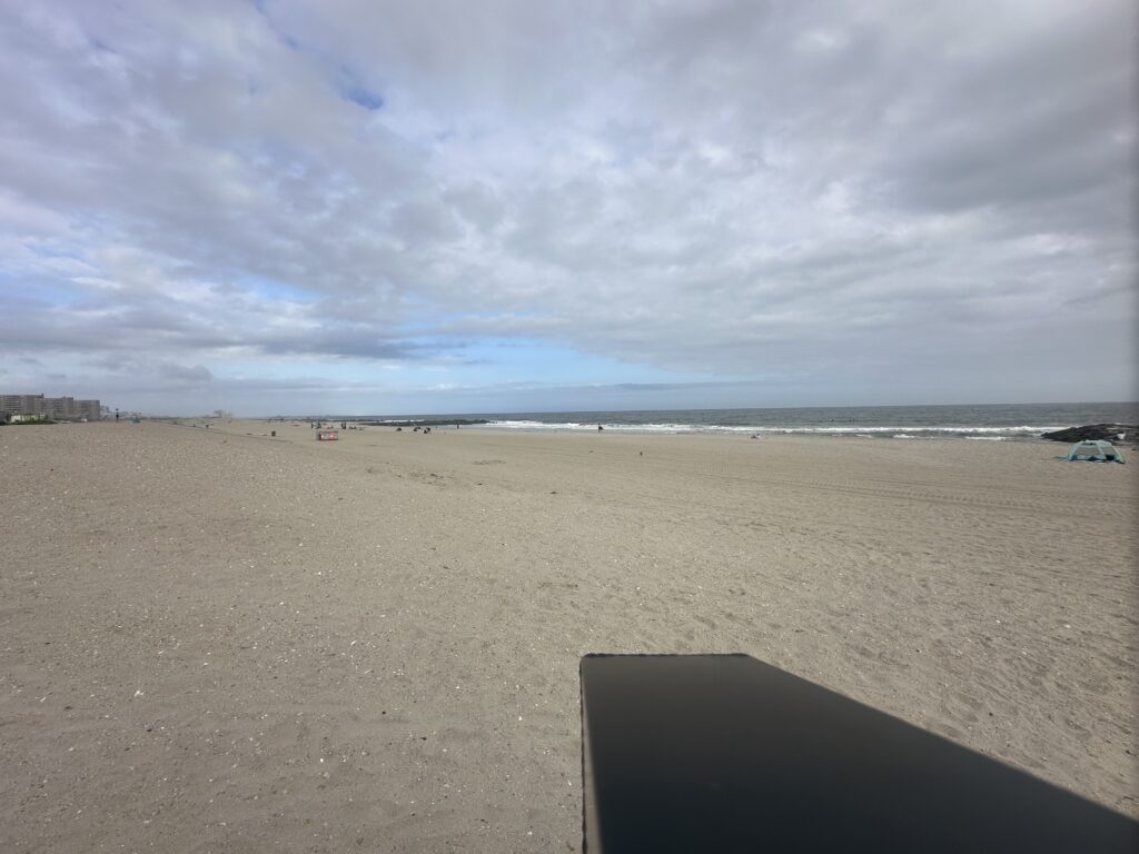 a sandy beach with a laptop (MyCoast AI)