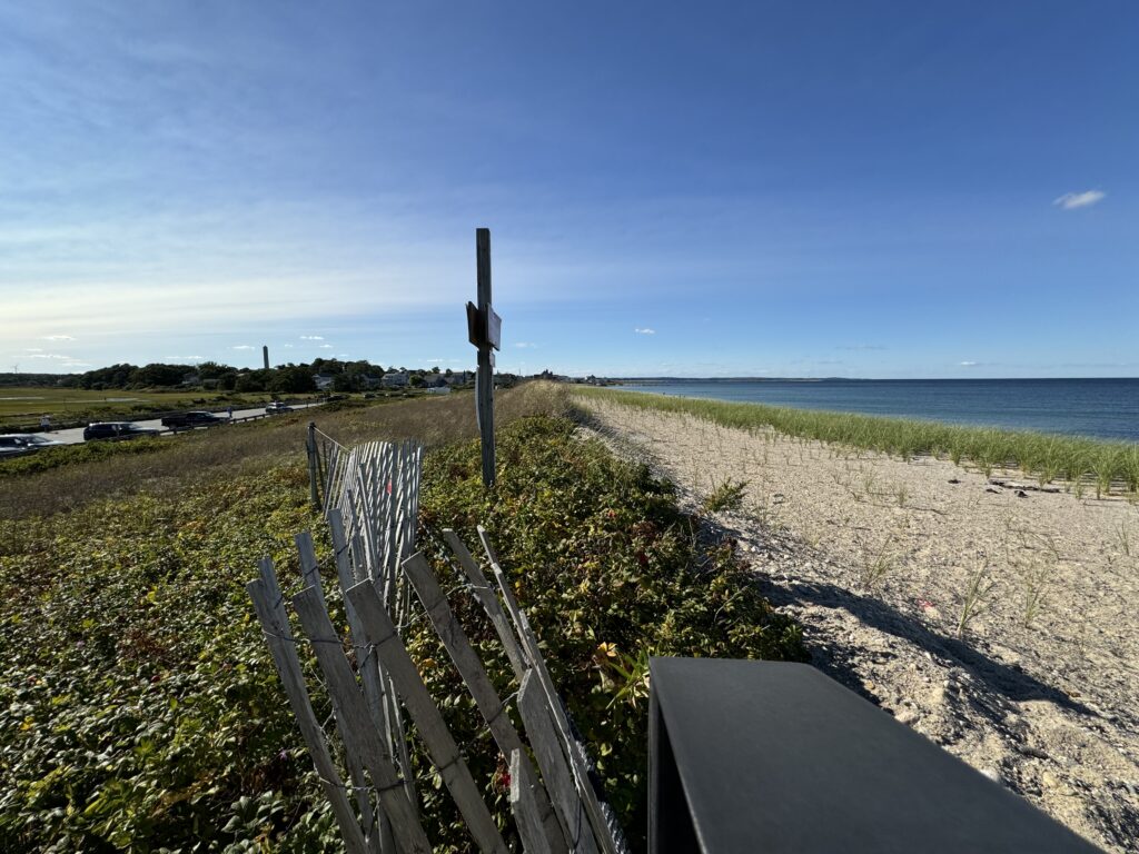 a wooden fence on a beach (MyCoast AI)