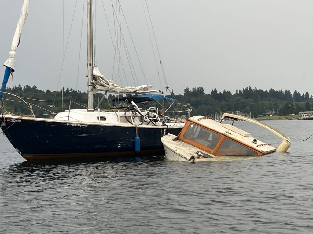 a couple of boats sit in the water (MyCoast AI)
