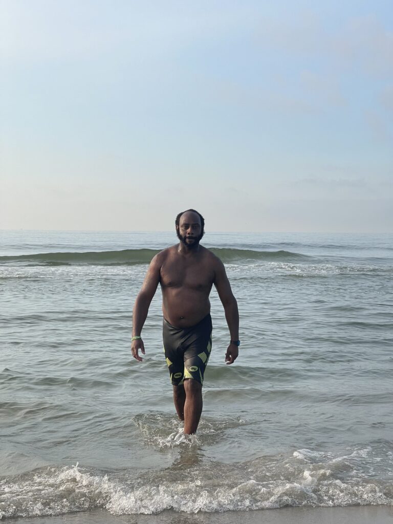 a man standing in the water (MyCoast AI)