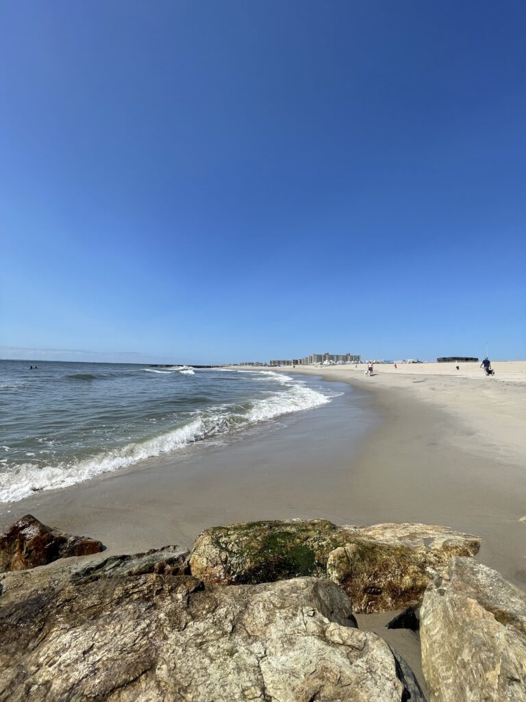 a beach with rocks and water (MyCoast AI)