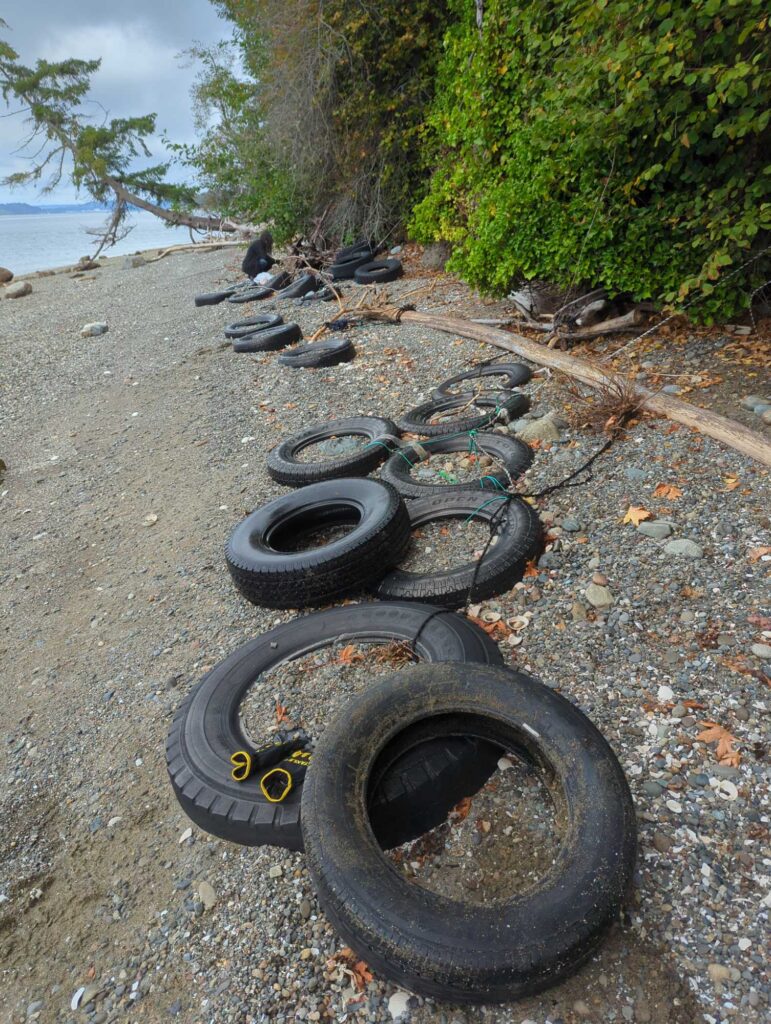 a pile of tires on a beach (MyCoast AI)