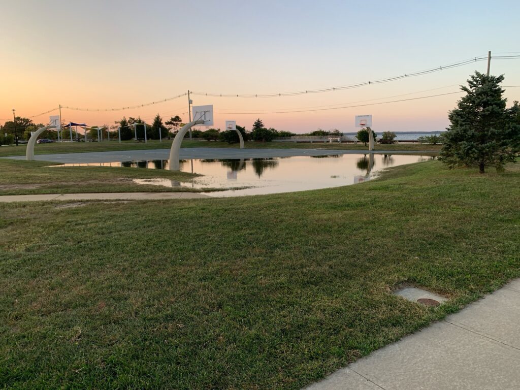 a pond with a large white structure in the middle (MyCoast AI)