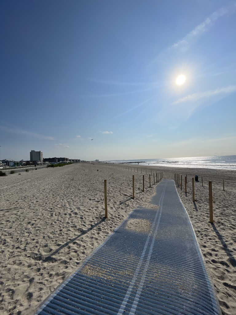 a blue boardwalk on a beach (MyCoast AI)