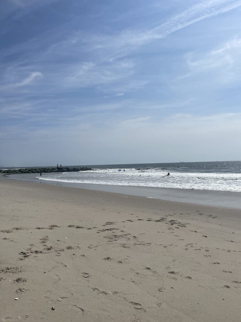 a beach with waves crashing on it (MyCoast AI)