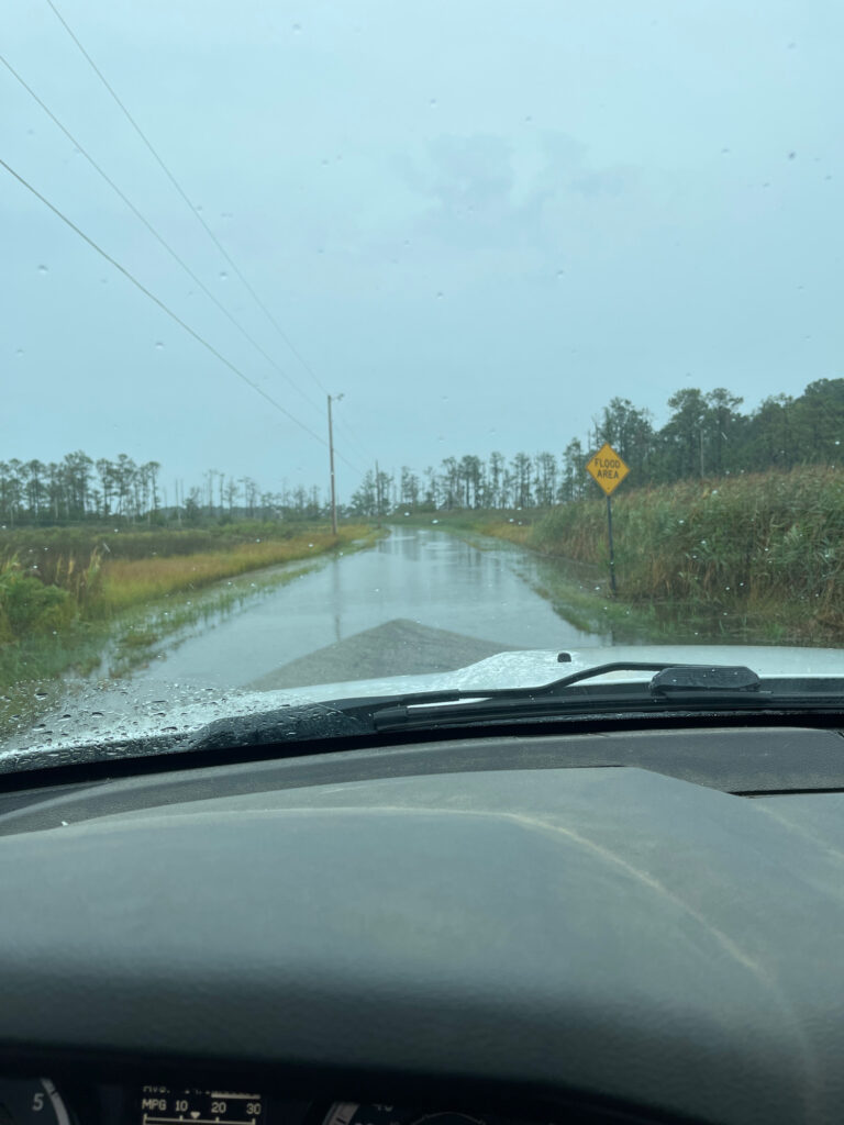a car driving on a wet road (MyCoast AI)