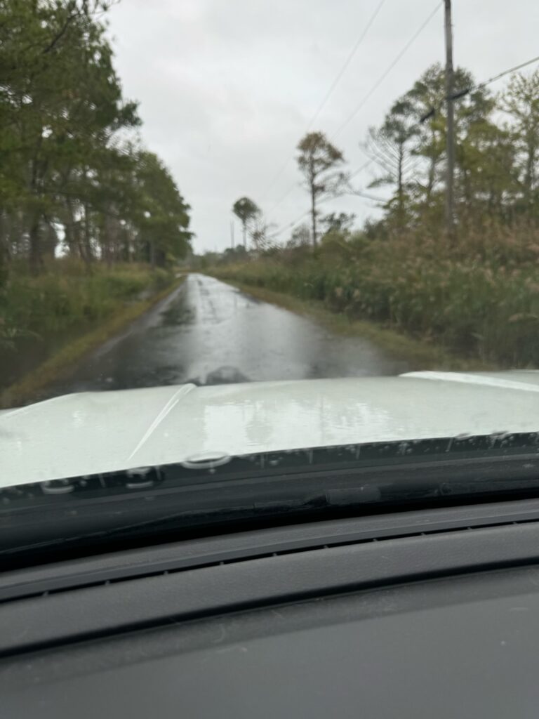 a car driving on a wet road (MyCoast AI)