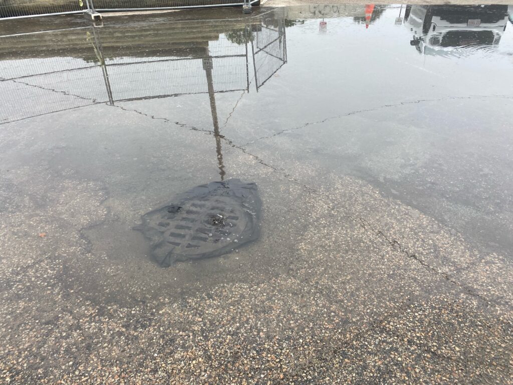 a puddle on the ground (MyCoast AI)