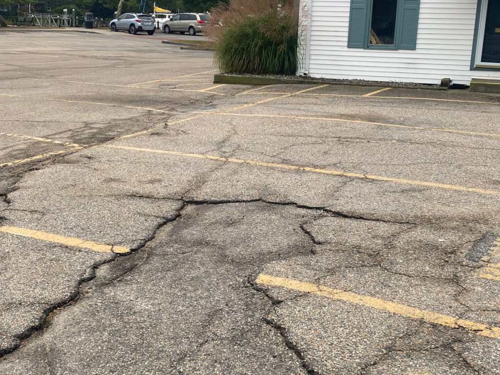a street with cars parked on the side (MyCoast AI)